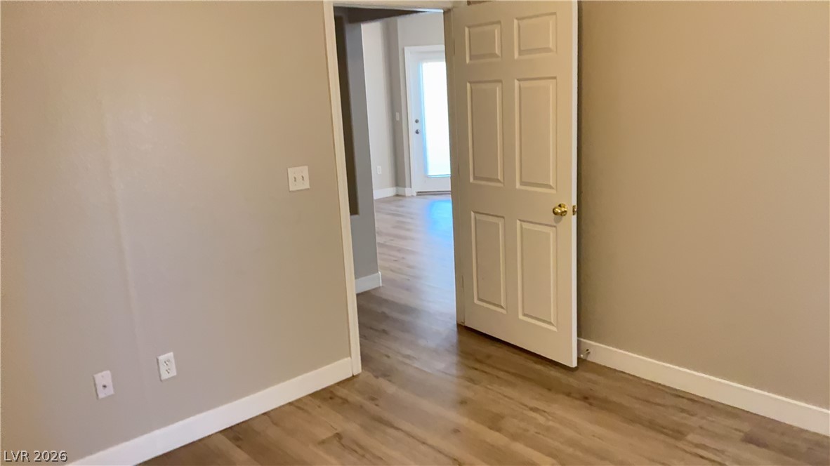 830 Carnegie Street, Unit 1024 Henderson, NV 89052 - Photo 16 of 27 Unfurnished room with light wood finished floors and baseboards