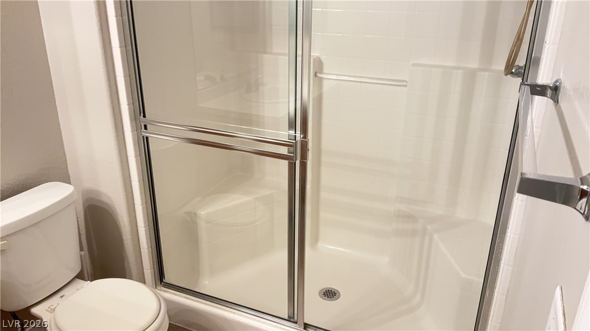 830 Carnegie Street, Unit 1024 Henderson, NV 89052 - Photo 19 of 27 Full bathroom featuring a shower stall and toilet