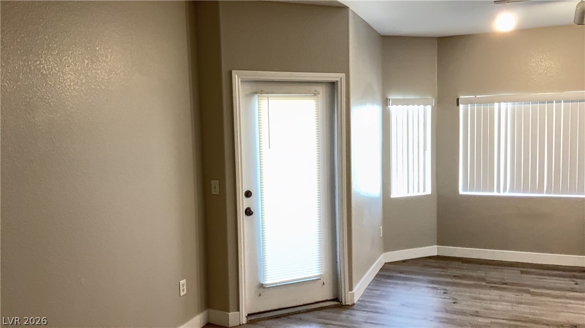 830 Carnegie Street, Unit 1024 Henderson, NV 89052 - Photo 5 of 27 Entryway featuring wood finished floors and a textured wall