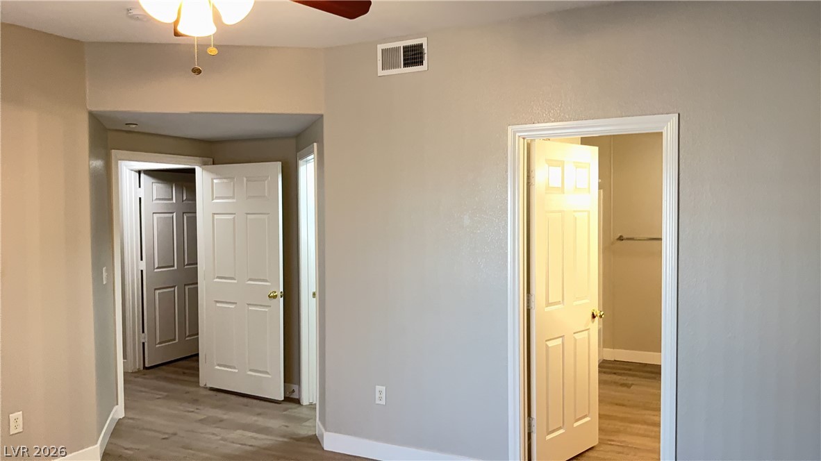830 Carnegie Street, Unit 1024 Henderson, NV 89052 - Photo 10 of 27 Unfurnished bedroom with light wood-style flooring and a ceiling fan