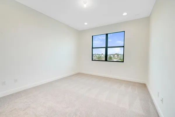 a bathroom with a granite countertop sink a toilet and bathtub
