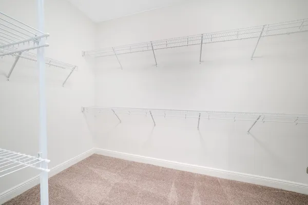 a spacious bathroom with a tub sink and shower