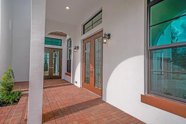 a front view of a house with a porch