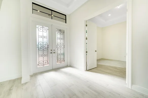 a view of an empty room with a window