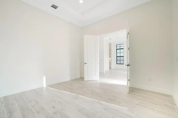 a view of an entryway with wooden floor
