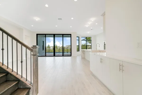 a view of an empty room with a sliding door