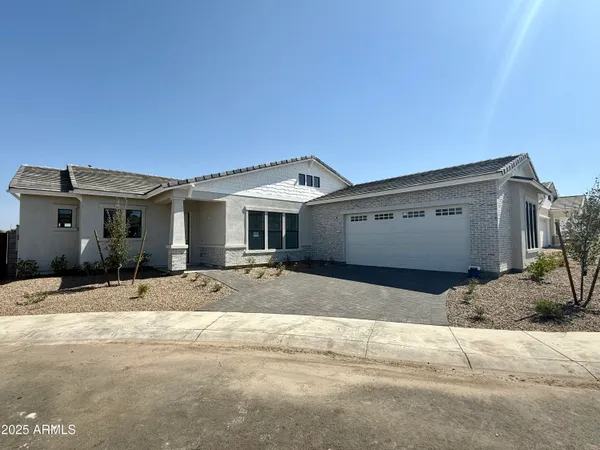a front view of a house with a outdoor space