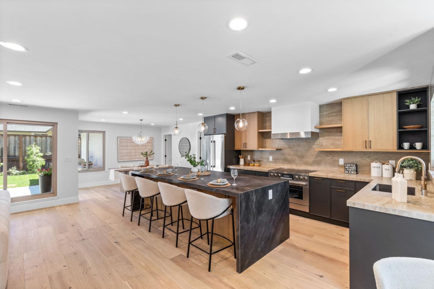 1961 Fordham Way Mountain View, CA 94040 - Photo 14 of 29 a kitchen with stainless steel appliances granite countertop table chairs sink and cabinets