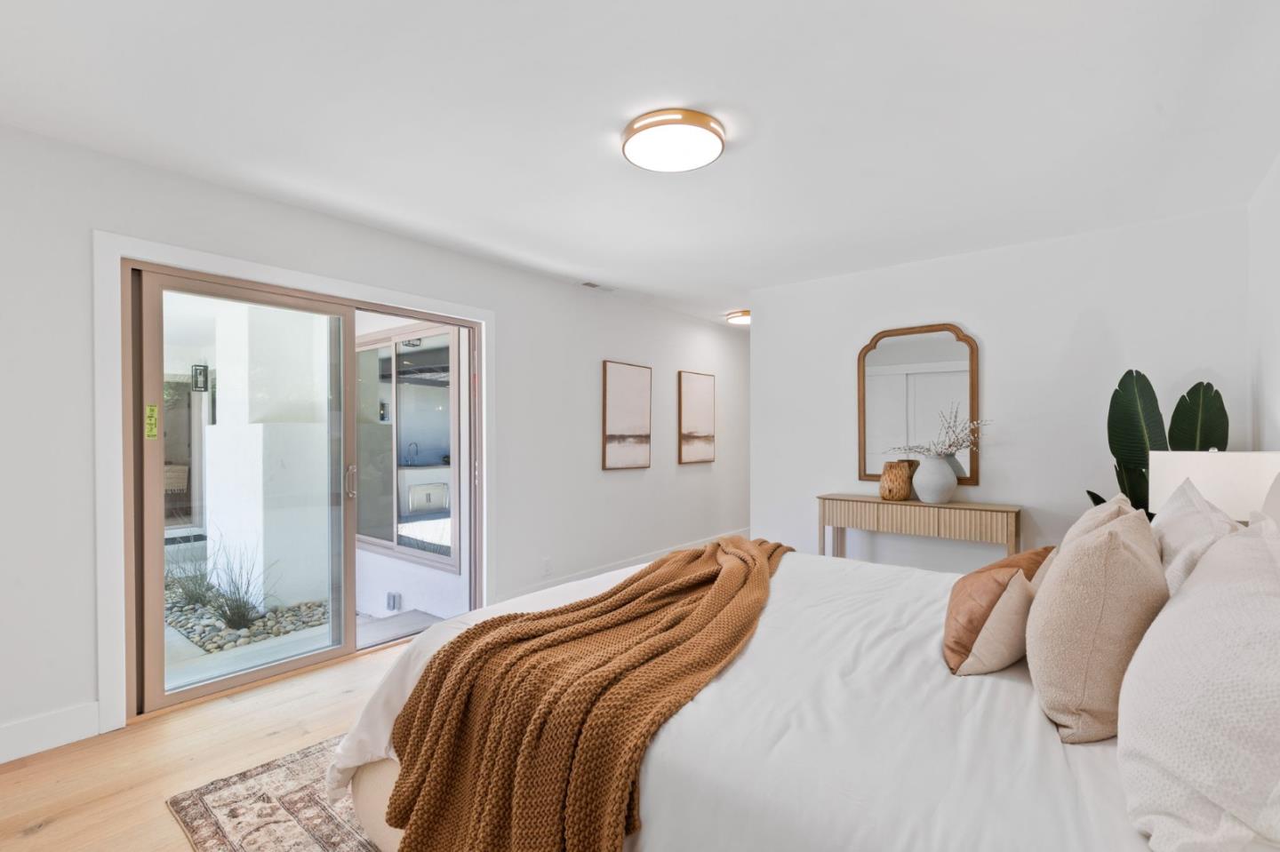 1961 Fordham Way Mountain View, CA 94040 - Photo 20 of 29 a bedroom with bed and a large mirror next to a window