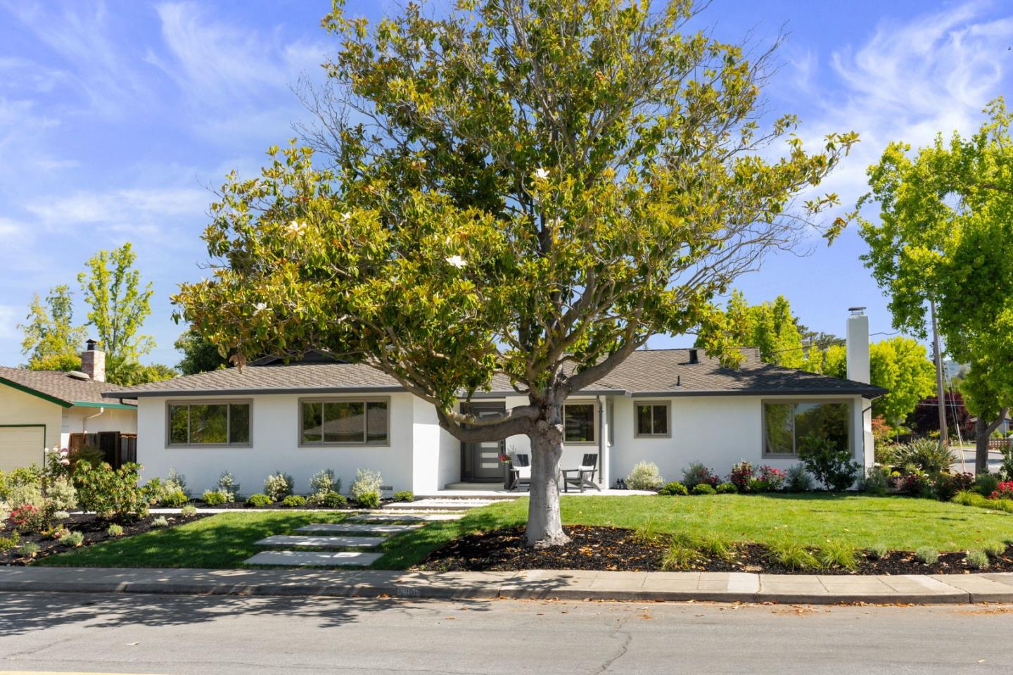 1961 Fordham Way Mountain View, CA 94040 - Photo 2 of 29 a front view of a house with a yard and a garage