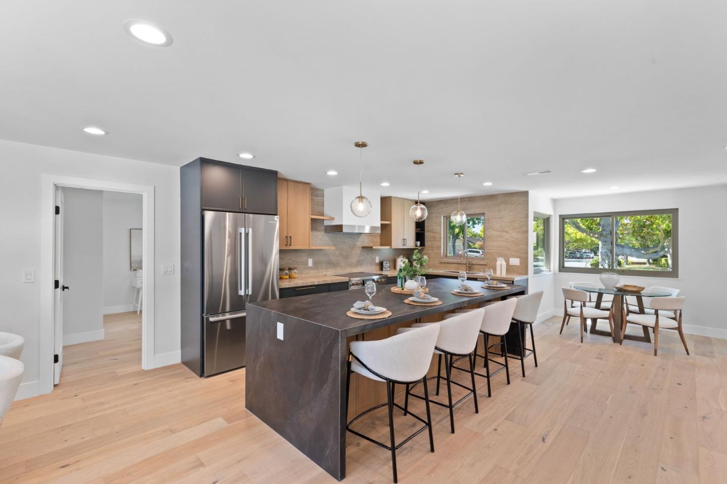 1961 Fordham Way Mountain View, CA 94040 - Photo 10 of 29 a dining hall with stainless steel appliances a dining table and chairs with wooden floor