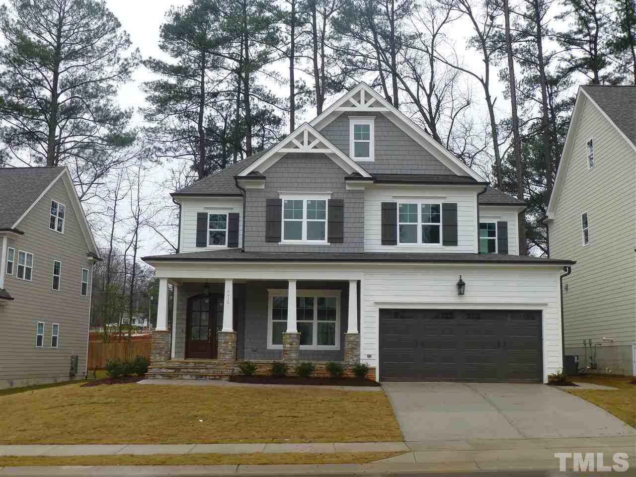6415 Rosny Road Raleigh, NC 27613 - Photo 1 of 25 a front view of a house with a yard