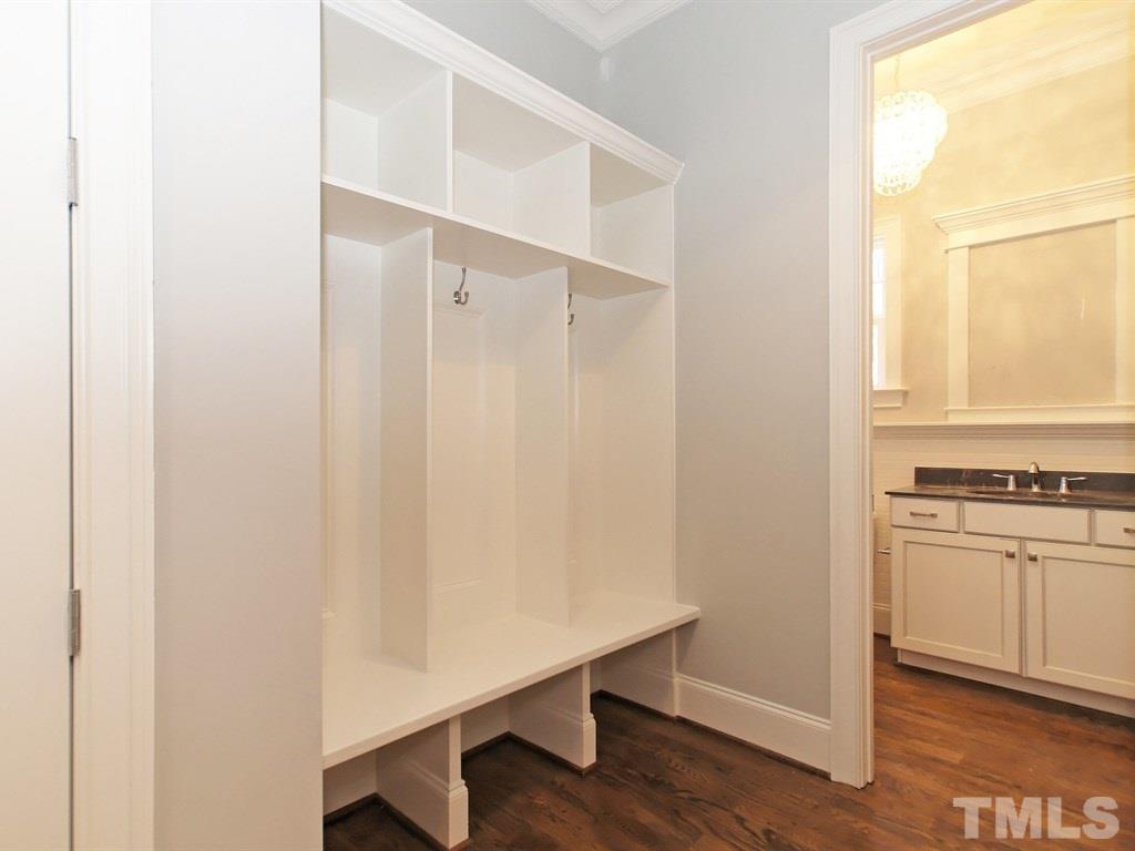 6415 Rosny Road Raleigh, NC 27613 - Photo 13 of 25 a room with a bench and a window