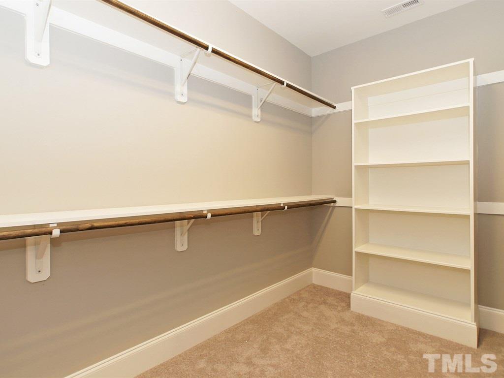 6415 Rosny Road Raleigh, NC 27613 - Photo 16 of 25 a view of an empty walk in closet