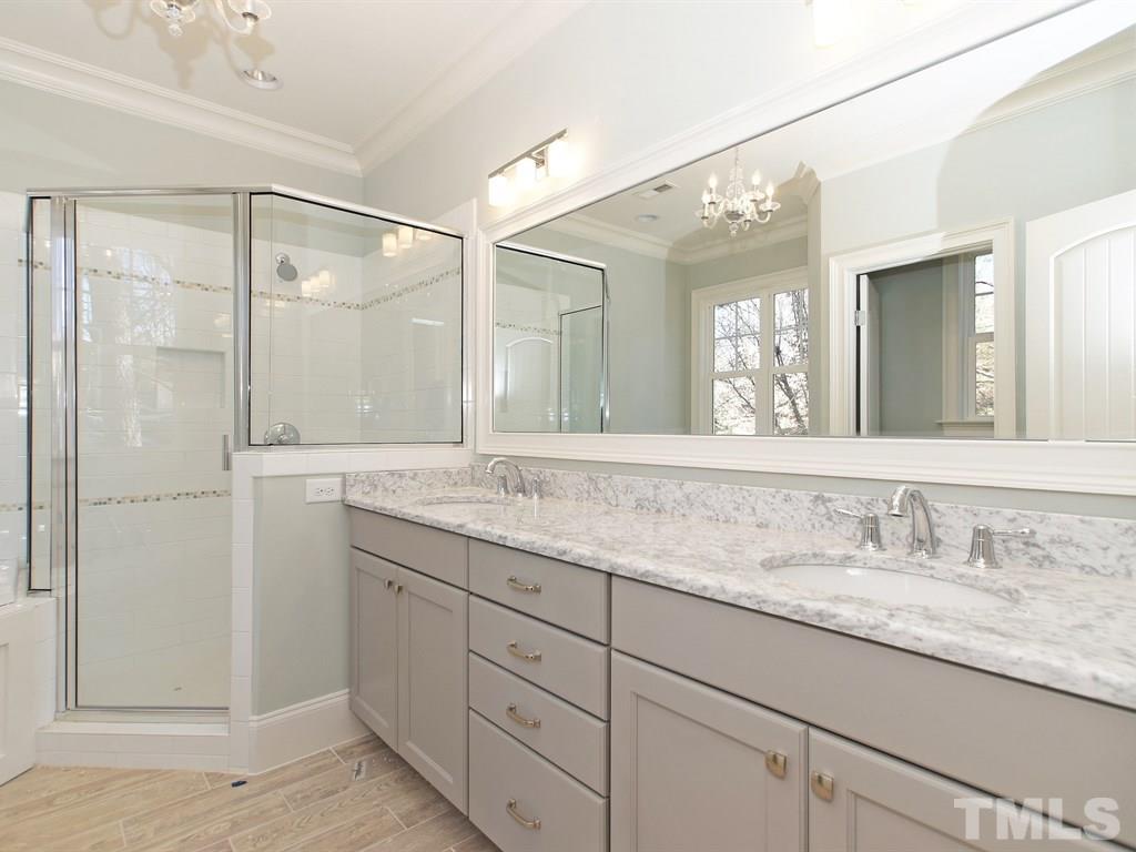 6415 Rosny Road Raleigh, NC 27613 - Photo 17 of 25 a bathroom with a granite countertop sink mirror and double