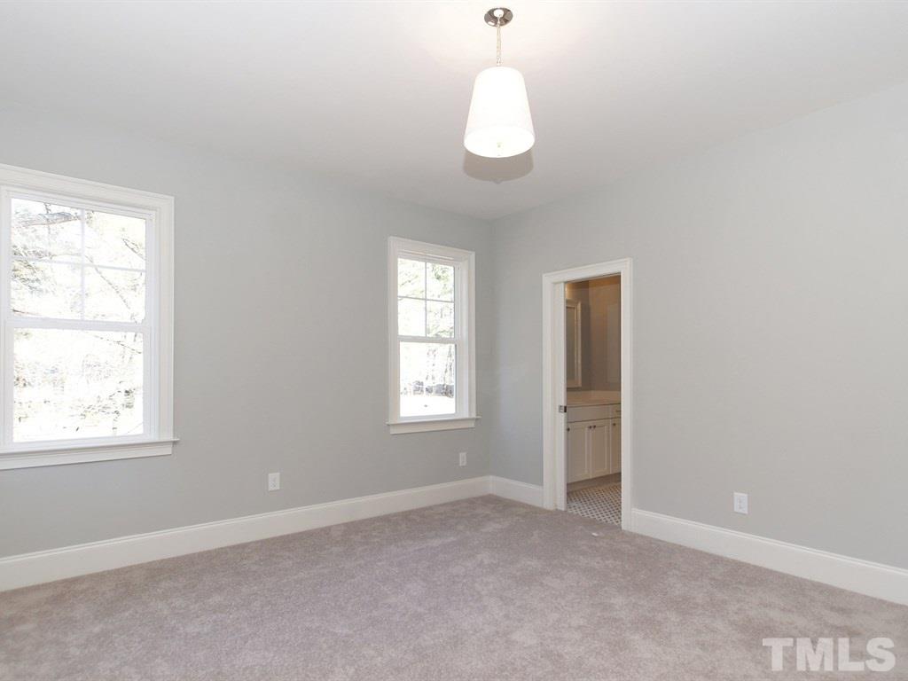 6415 Rosny Road Raleigh, NC 27613 - Photo 19 of 25 an empty room with windows