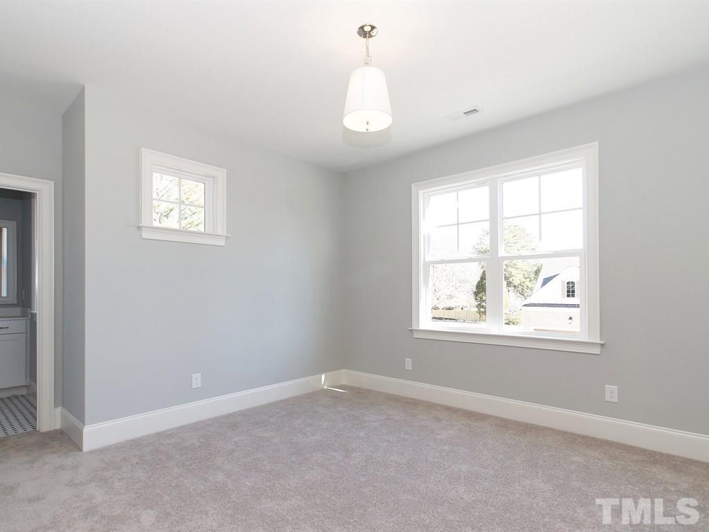 6415 Rosny Road Raleigh, NC 27613 - Photo 21 of 25 an empty room with a window