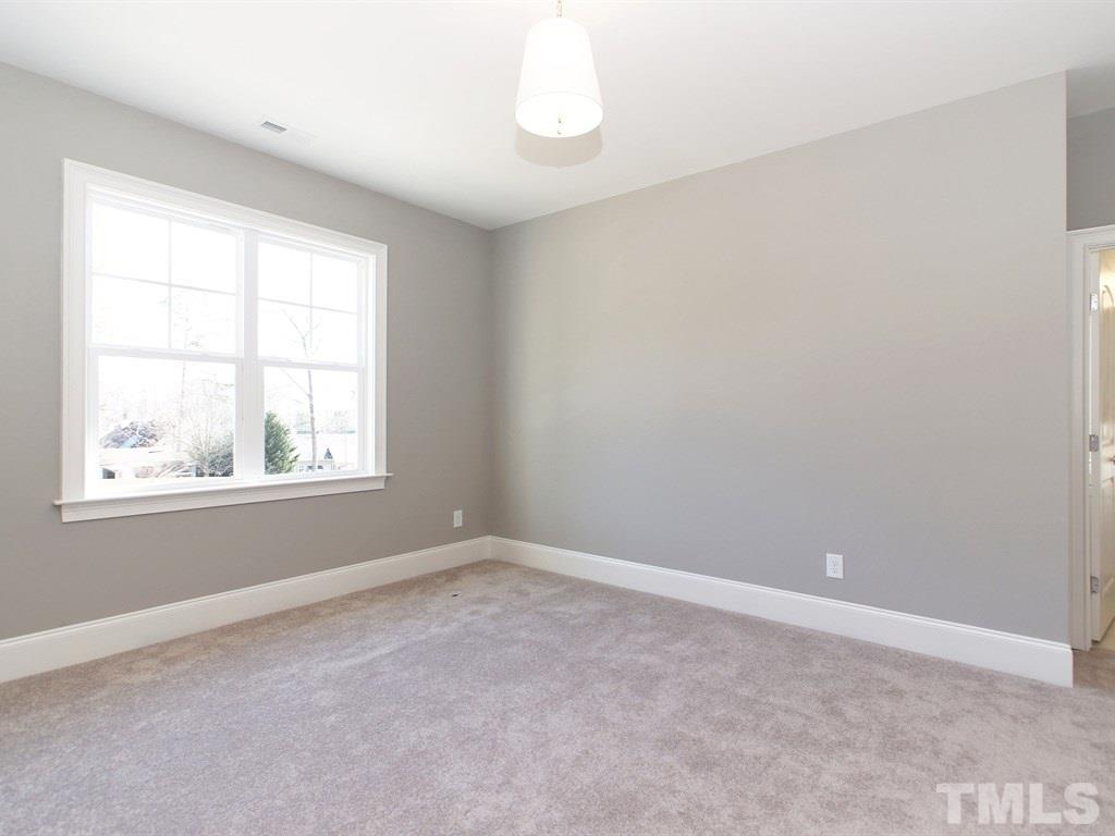 6415 Rosny Road Raleigh, NC 27613 - Photo 22 of 25 an empty room with a window