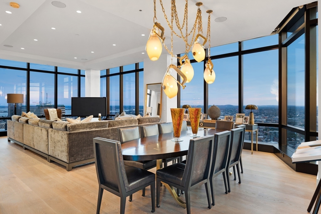 a large kitchen with a table and chairs