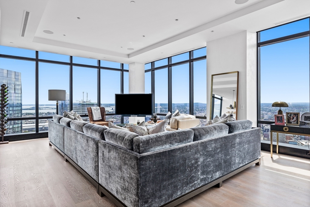 1 Franklin Street, Unit PH3E Boston, MA 02110 - Photo 16 of 42 a living room with furniture and a flat screen tv