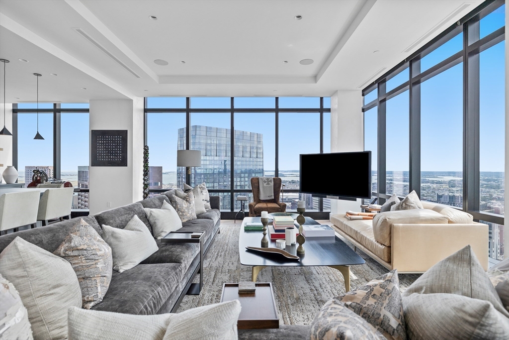 1 Franklin Street, Unit PH3E Boston, MA 02110 - Photo 17 of 42 a living room with furniture and a flat screen tv