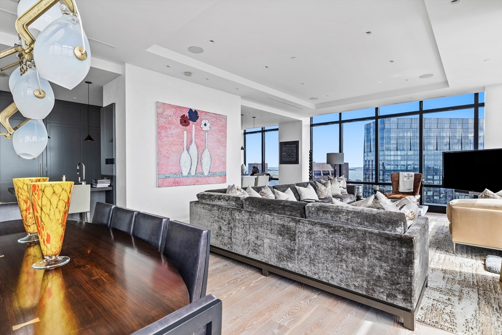 1 Franklin Street, Unit PH3E Boston, MA 02110 - Photo 18 of 42 a living room with furniture and a flat screen tv