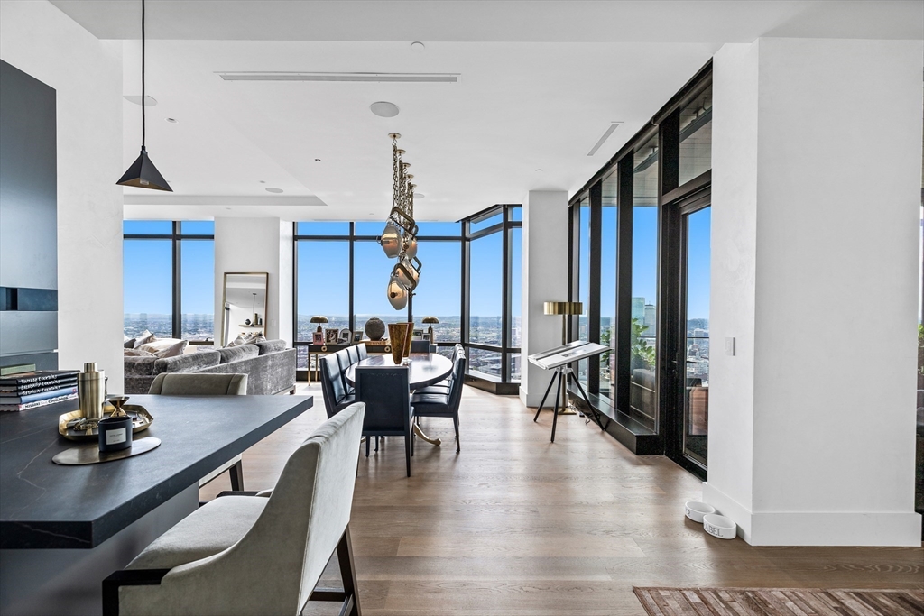 1 Franklin Street, Unit PH3E Boston, MA 02110 - Photo 19 of 42 a living room with lots of furniture and a large window