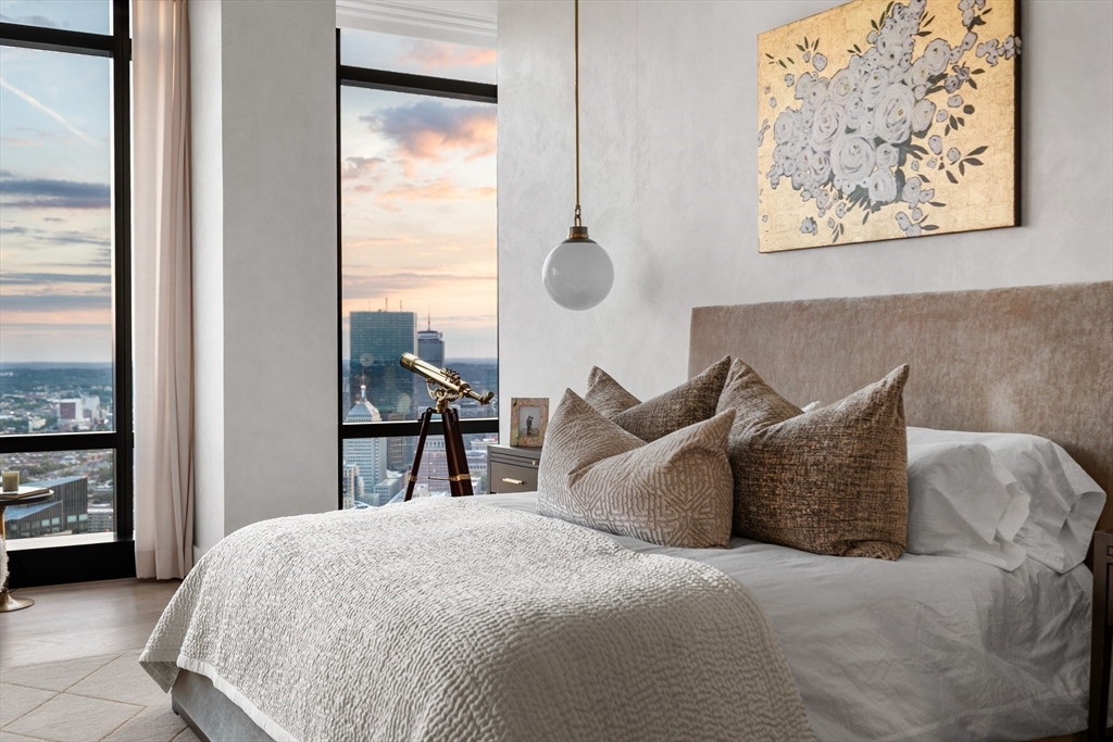 1 Franklin Street, Unit PH3E Boston, MA 02110 - Photo 25 of 42 a bed sitting in a bedroom next to a window