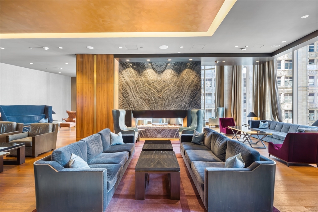 1 Franklin Street, Unit PH3E Boston, MA 02110 - Photo 39 of 42 a living room with furniture and a large window