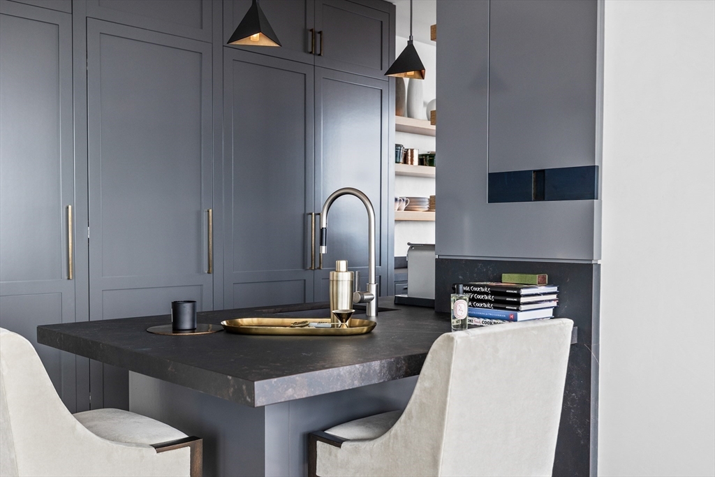 1 Franklin Street, Unit PH3E Boston, MA 02110 - Photo 8 of 42 a kitchen with a sink cabinets and appliances