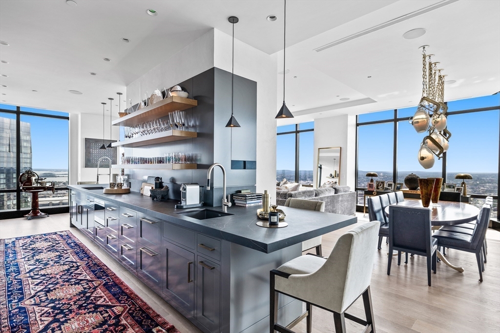 1 Franklin Street, Unit PH3E Boston, MA 02110 - Photo 10 of 42 a large kitchen with a table and chairs