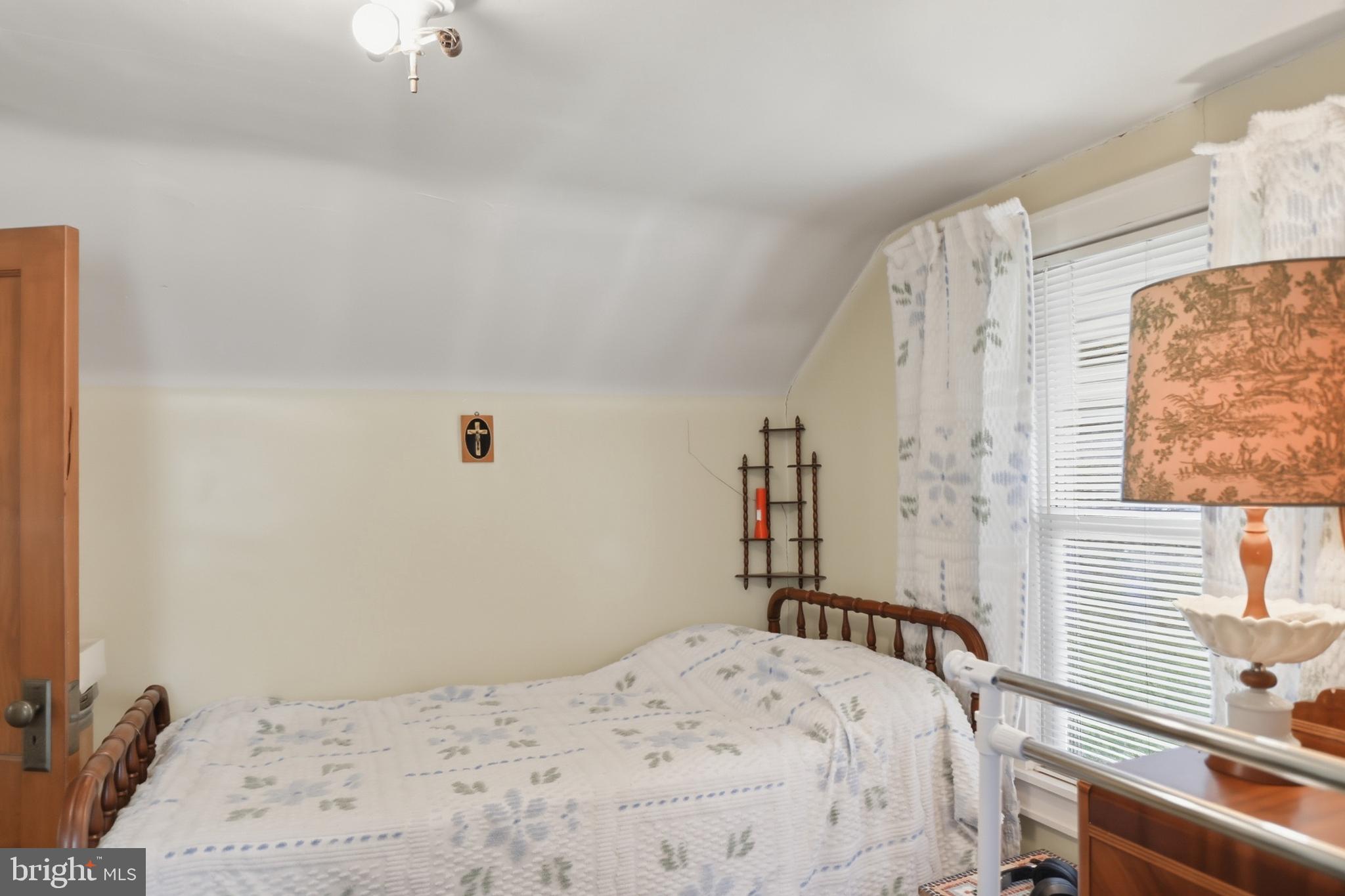 378 Spruce Street Thomas, WV 26292 - Photo 17 of 30 a bedroom with a bed and a window