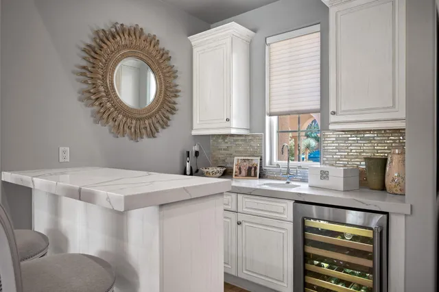 a bathroom with a sink a mirror and vanity
