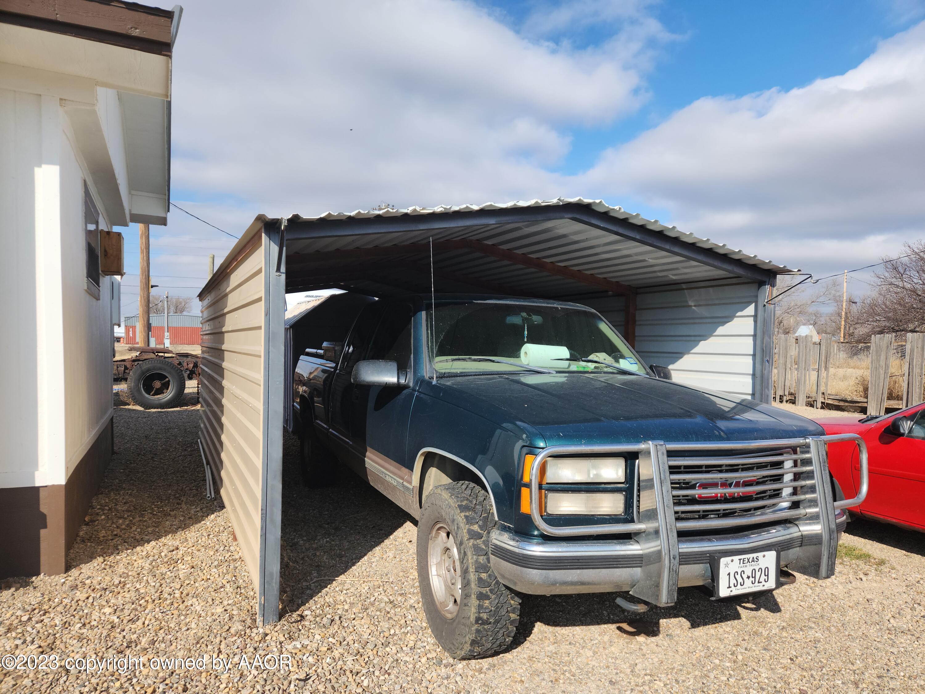 304 Collins Street Claude, TX 79019 - Photo 11 of 11 a view of a car park in front of house