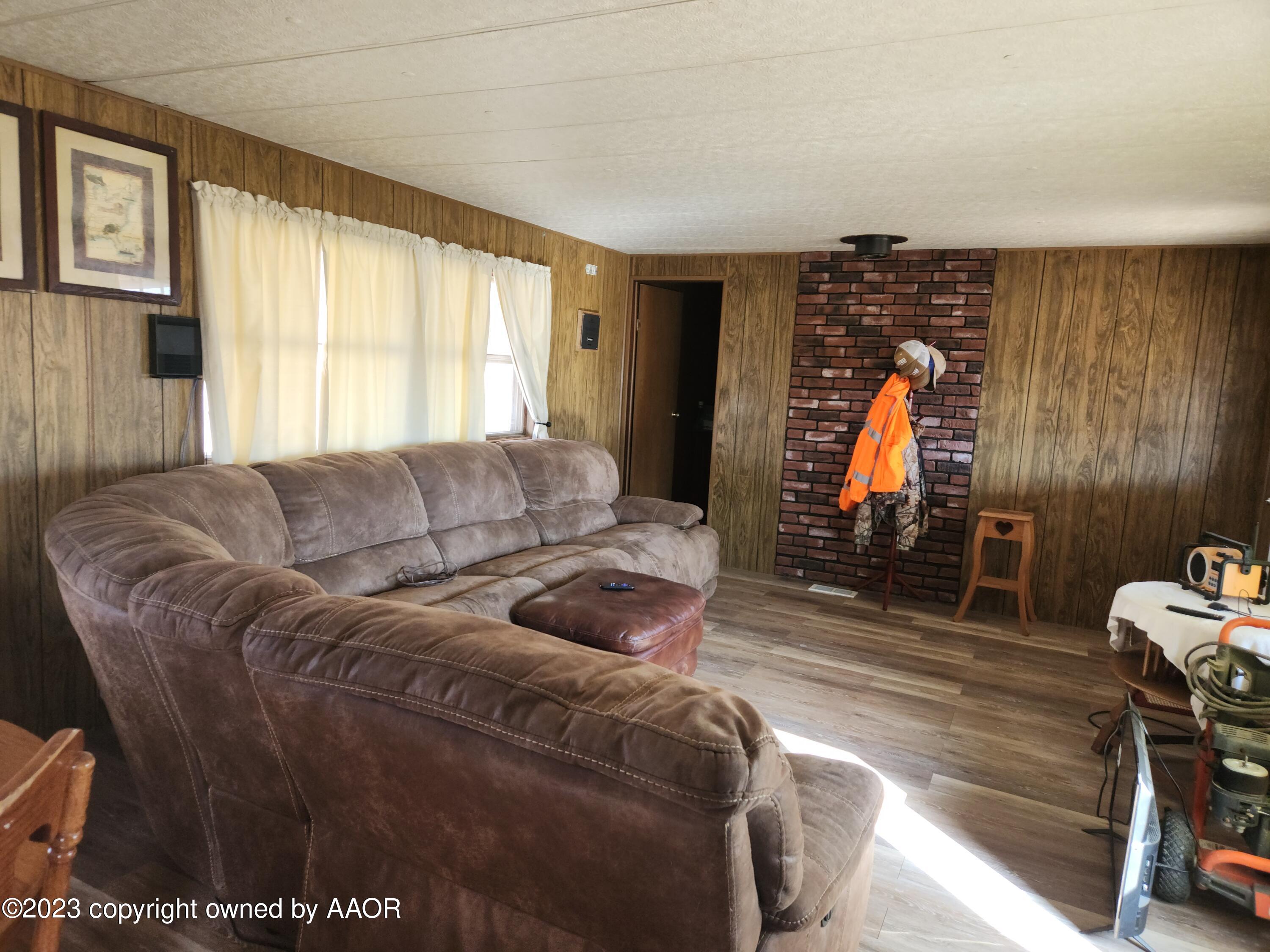 304 Collins Street Claude, TX 79019 - Photo 4 of 11 a living room with furniture and a window