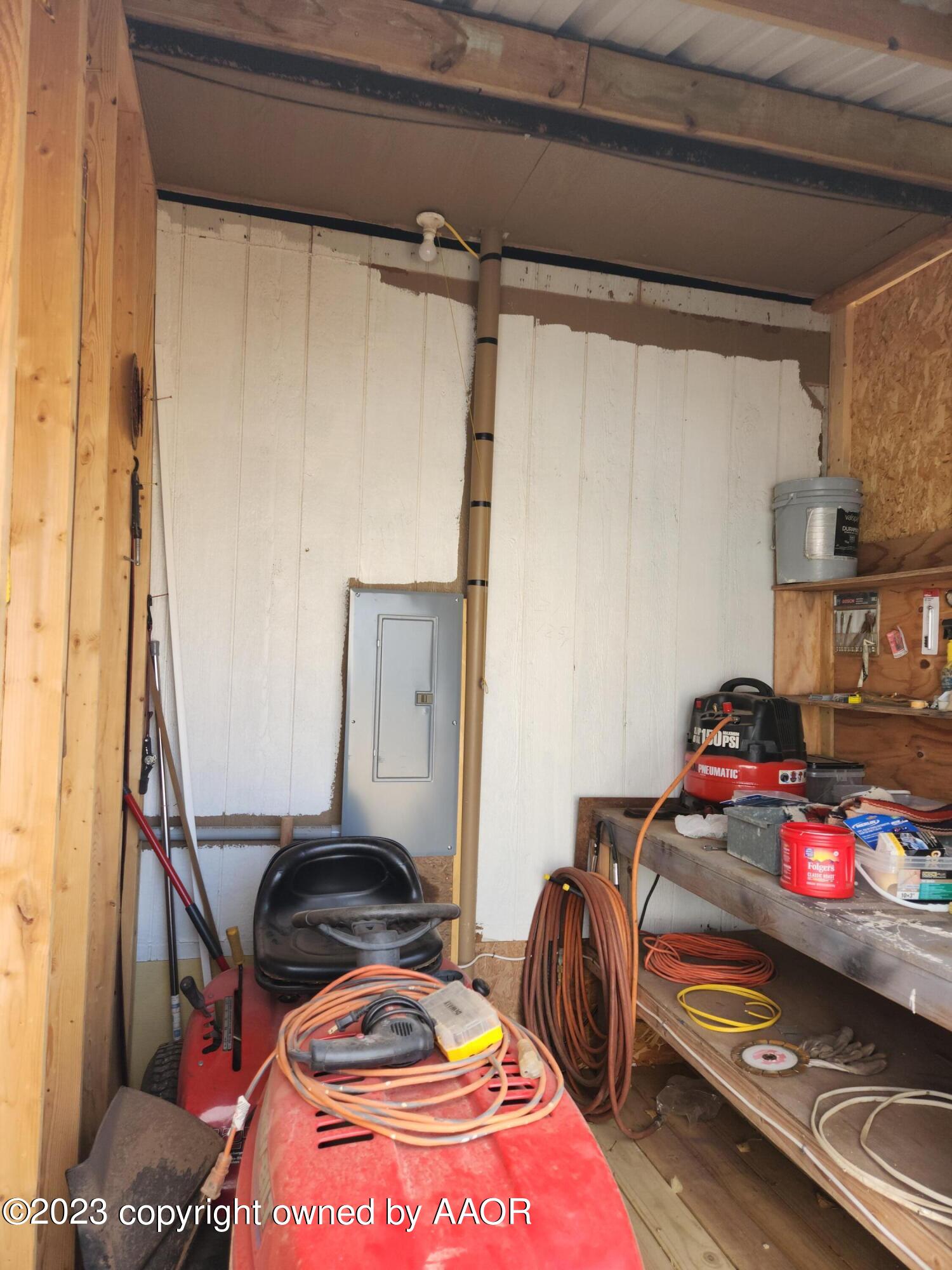 304 Collins Street Claude, TX 79019 - Photo 10 of 11 a bedroom with a bed and a mirror
