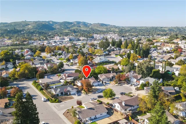 an aerial view of residential houses and city view