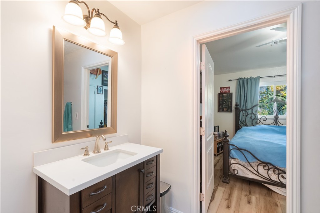 419 Cherokee Court Paso Robles, CA 93446 - Photo 6 of 16 a en suite bathroom with a sink and a mirror
