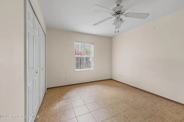 a bathroom with a granite countertop sink a mirror and a bathtub