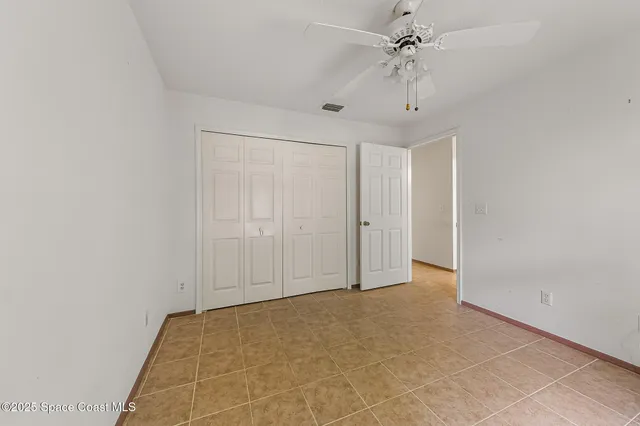 a view of an empty room with windows