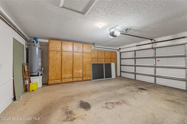 a view of a house with pool and sitting area
