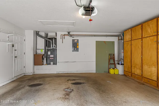 a view of a swimming pool with a sink and wooden fence