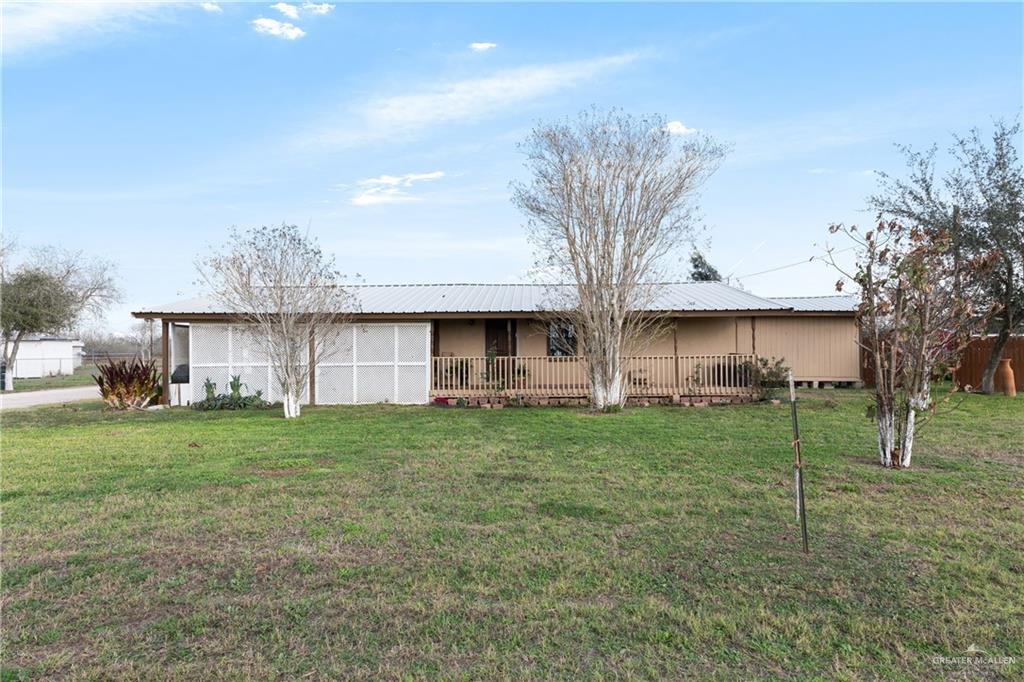 21446 Sunflower Road Edinburg, TX 78542 - Photo 1 of 1 Back of property featuring a yard