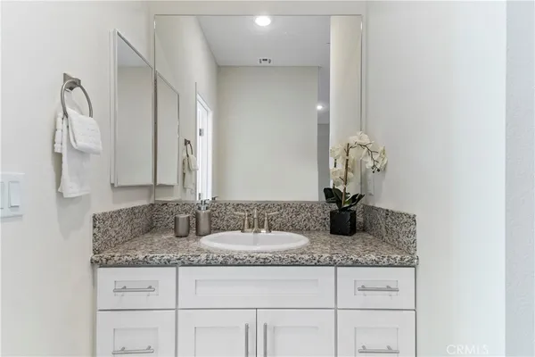 a bathroom with a bathtub a shower and a window