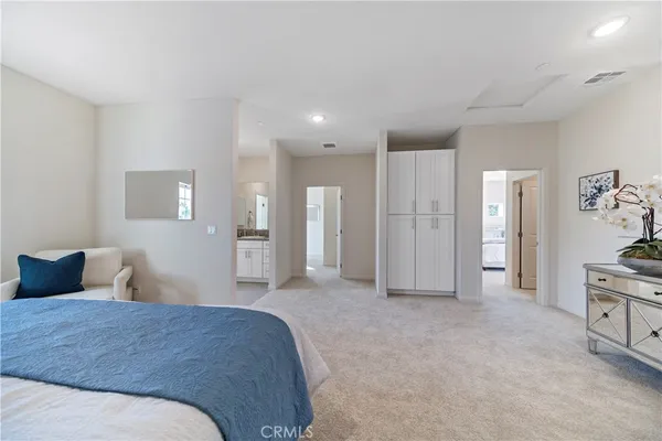 a bathroom with a granite countertop sink toilet a large mirror a bathtub and shower