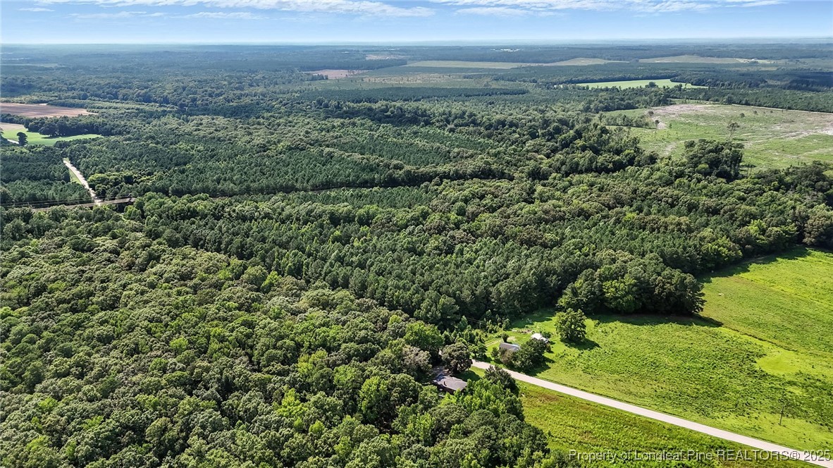 5725 River Road Wade, NC 28395 - Photo 20 of 35 a view of a yard with an outdoor seating