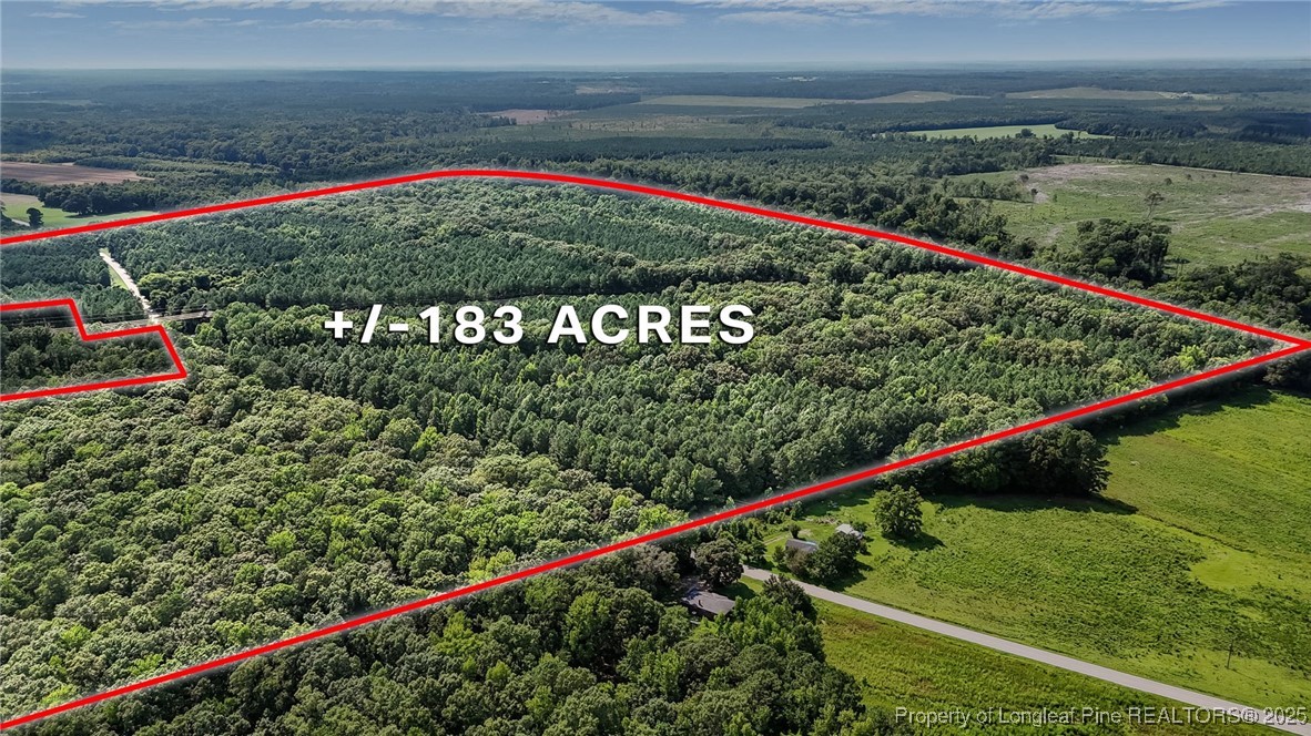 5725 River Road Wade, NC 28395 - Photo 6 of 35 a view of a field with wooden fence