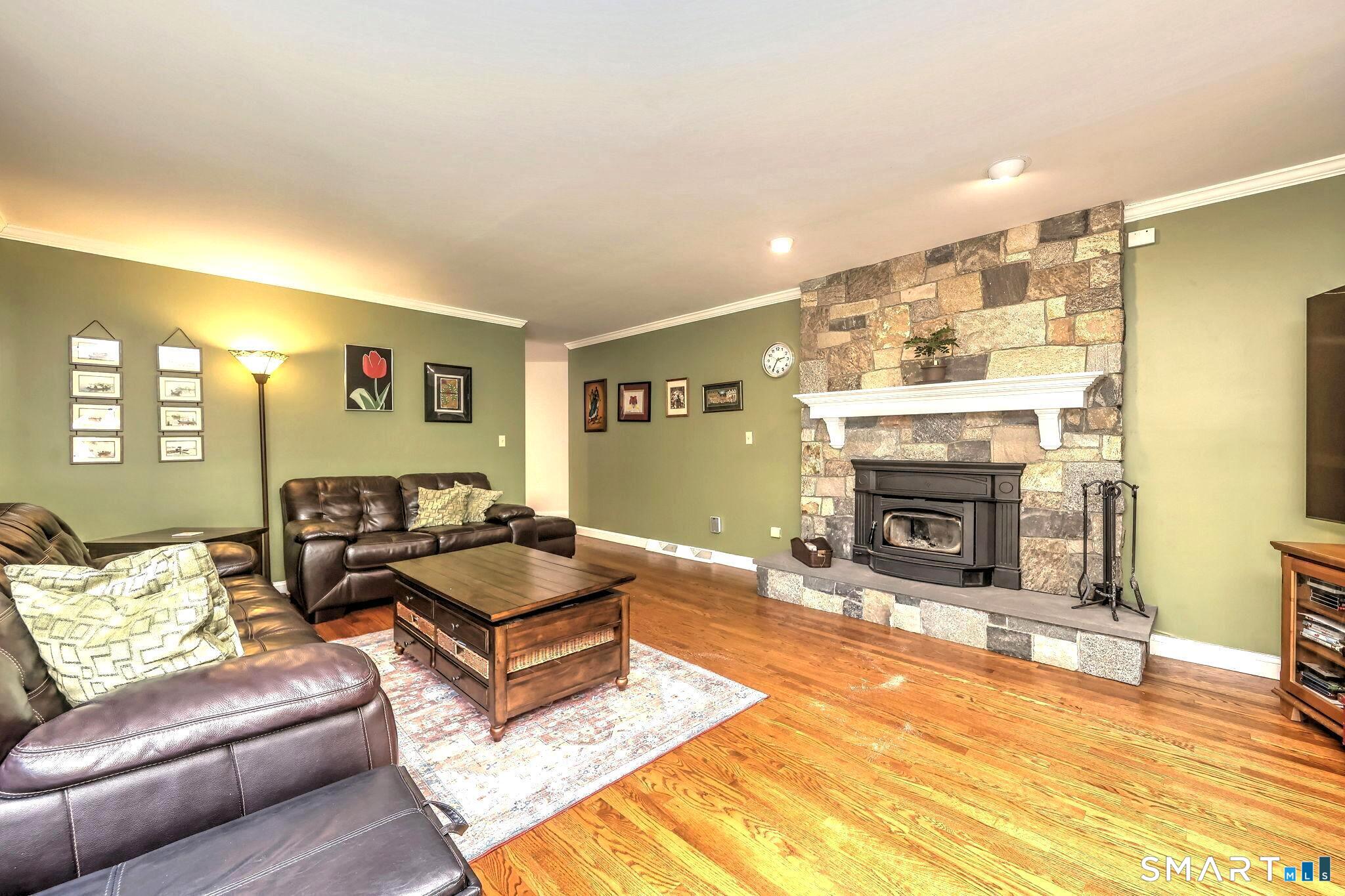 60 West Meadow Road Hamden, CT 06518 - Photo 14 of 35 The family room, right off the kitchen provides a comfortable, homey place to relax.Enjoy the attractive fireplace with stove insert ,toasty in the chilly months