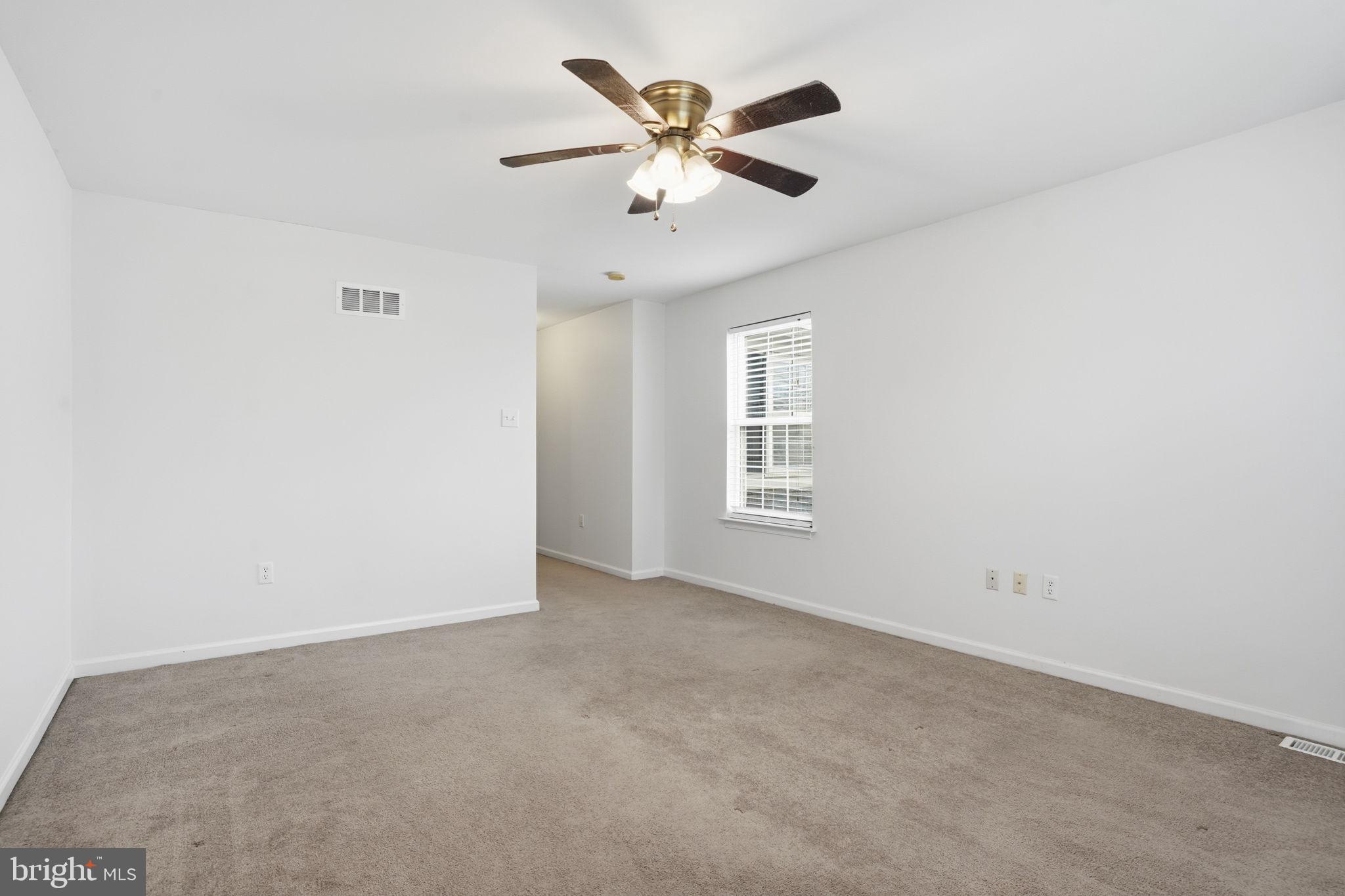 737 Seminary Street Pennsburg, PA 18073 - Photo 15 of 30 an empty room with windows and fan