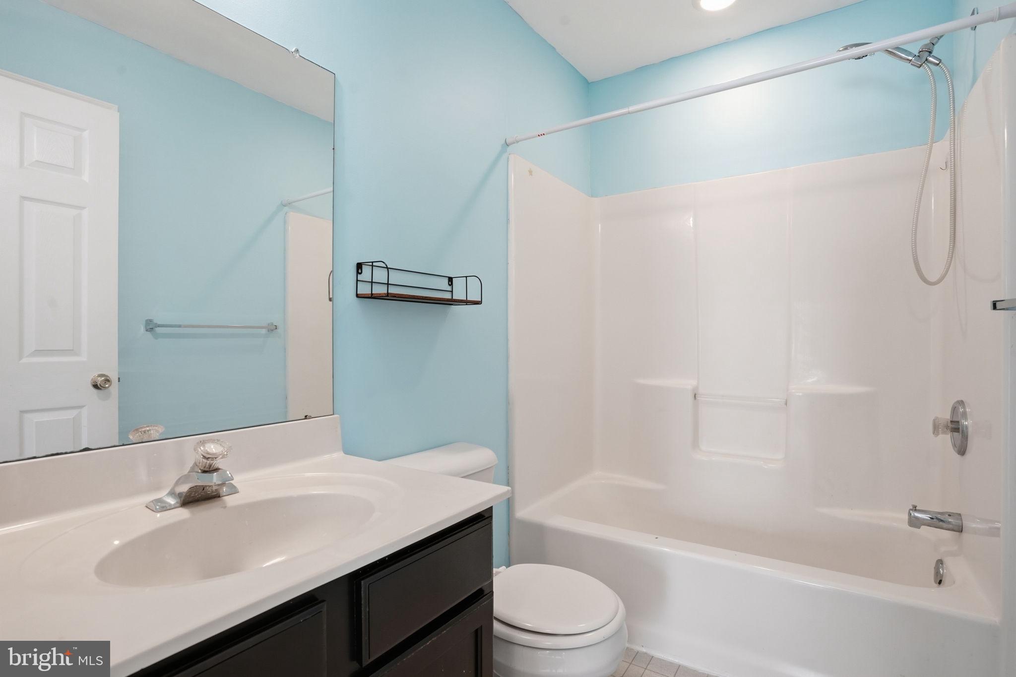737 Seminary Street Pennsburg, PA 18073 - Photo 21 of 30 a bathroom with a bathtub shower sink vanity and toilet